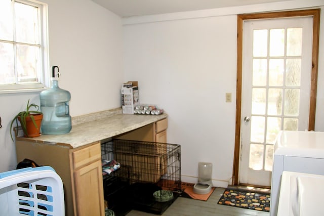 laundry area with cabinet space and separate washer and dryer