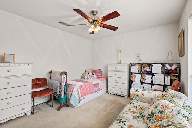 carpeted bedroom with visible vents and ceiling fan
