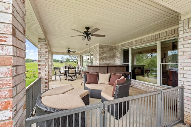 view of patio / terrace with outdoor dining area, ceiling fan, and an outdoor hangout area