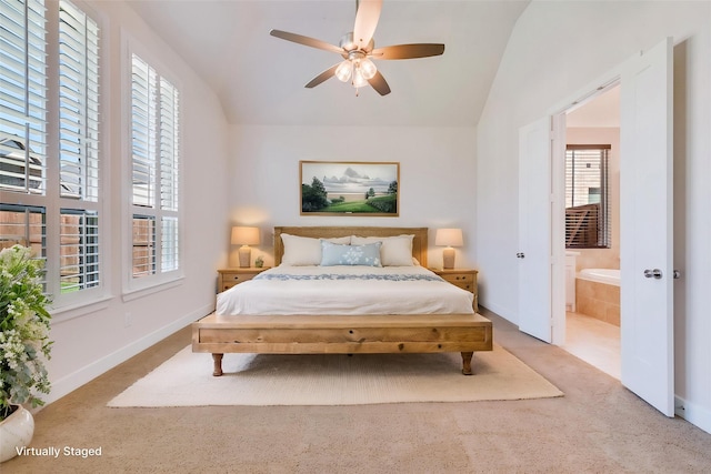 bedroom featuring carpet floors, lofted ceiling, and baseboards
