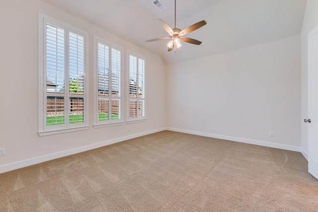carpeted empty room featuring visible vents, baseboards, and ceiling fan