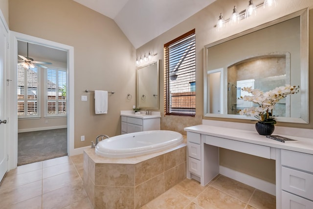 bathroom featuring vaulted ceiling, a bath, vanity, ceiling fan, and tile patterned flooring