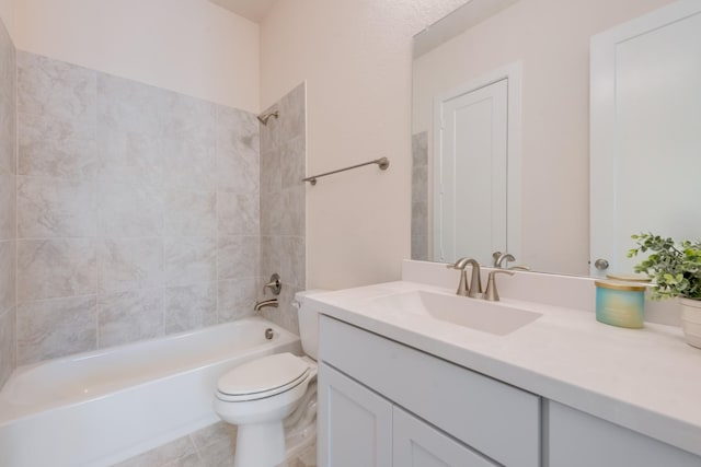 bathroom with toilet, vanity, and washtub / shower combination