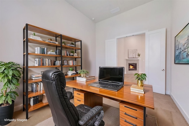 carpeted empty room with baseboards