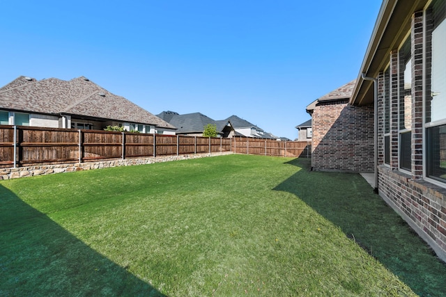 view of yard featuring a fenced backyard