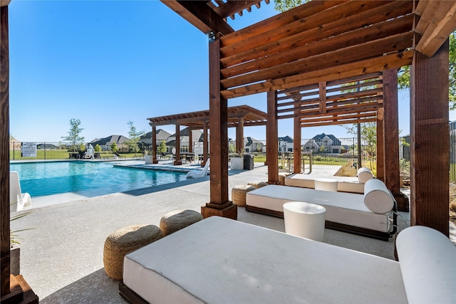 pool with a residential view, a patio area, and fence