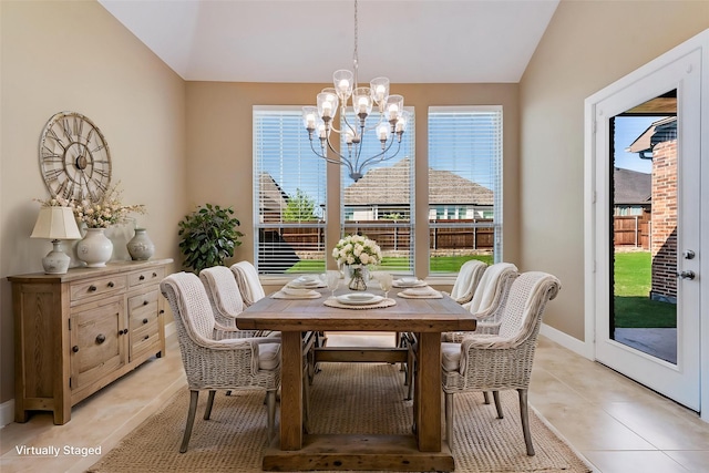dining space with vaulted ceiling, baseboards, an inviting chandelier, and light tile patterned floors
