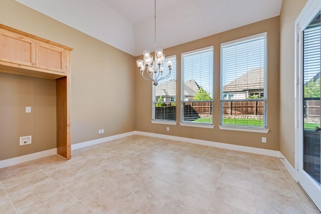 unfurnished dining area with plenty of natural light, light tile patterned floors, and an inviting chandelier