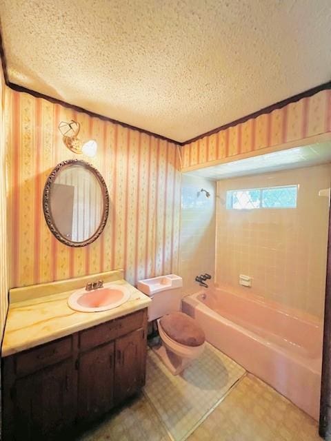 438 Atkins St, Sulphur Springs, TX 75482 - full bathroom with a textured ceiling, toilet, vanity, and shower / washtub combination