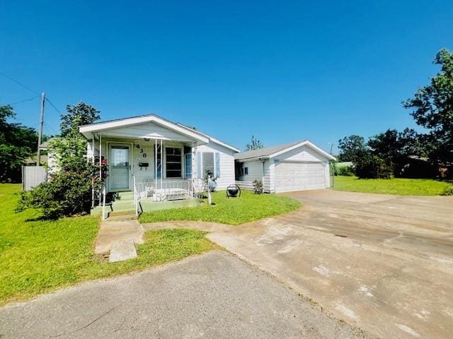 438 Atkins St, Sulphur Springs, TX 75482 - bungalow with a front lawn, driveway, covered porch, and a garage
