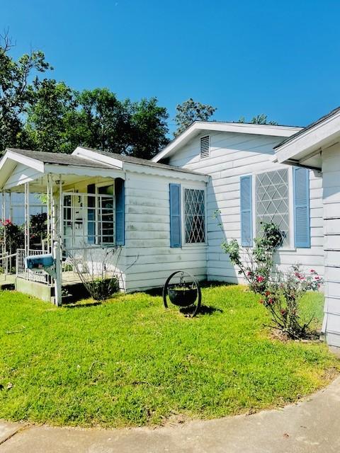 438 Atkins St, Sulphur Springs, TX 75482 - view of home's exterior with a yard