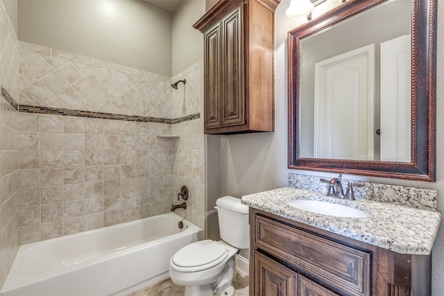 bathroom with a textured wall, vanity, shower / tub combination, and toilet