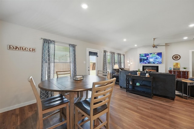 dining space with recessed lighting, wood finished floors, and a healthy amount of sunlight