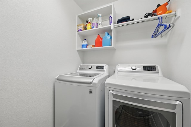 washroom featuring laundry area and washer and clothes dryer
