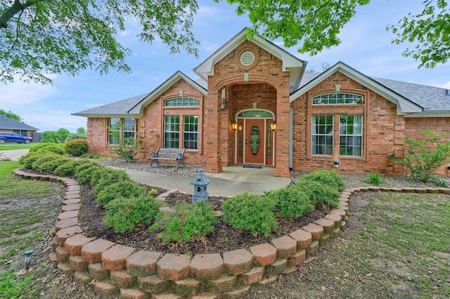 133 Chrissa Dr, Pottsboro, TX 75076 - view of front of property featuring brick siding and roof with shingles