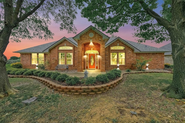 133 Chrissa Dr, Pottsboro, TX 75076 - view of front facade with brick siding, a front yard, and a shingled roof