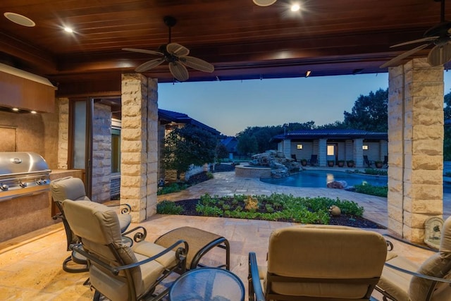view of patio / terrace with area for grilling, ceiling fan, and a pool with connected hot tub