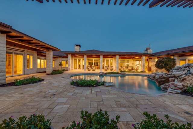 outdoor pool featuring a patio area