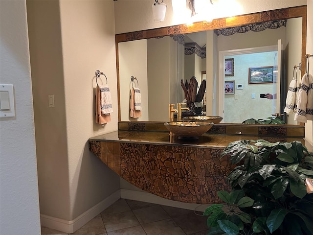 bathroom with tile patterned flooring and a sink