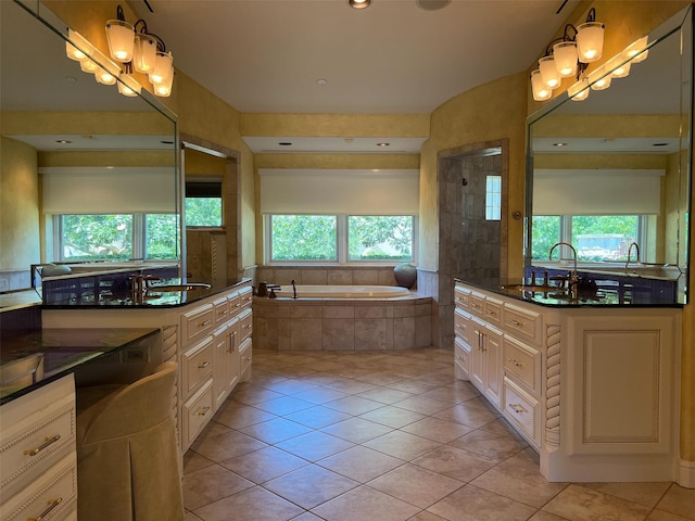 full bathroom featuring tile patterned floors, plenty of natural light, a bath, and tiled shower