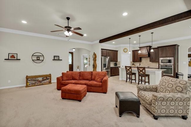 8450 Old Springtown Rd, Springtown, TX 76082 - living room with arched walkways, a ceiling fan, light colored carpet, and recessed lighting