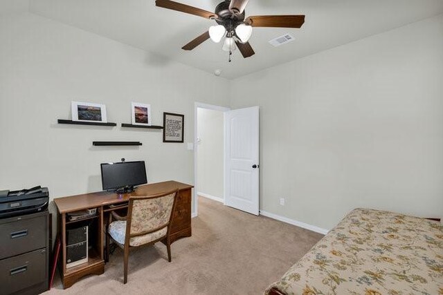 8450 Old Springtown Rd, Springtown, TX 76082 - home office with light carpet, baseboards, visible vents, and ceiling fan