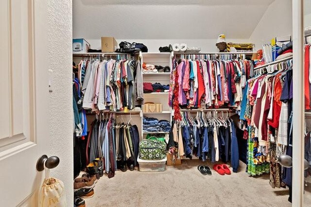 8450 Old Springtown Rd, Springtown, TX 76082 - spacious closet featuring lofted ceiling and carpet