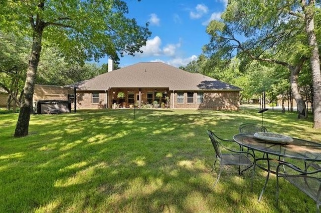 8450 Old Springtown Rd, Springtown, TX 76082 - back of property featuring a lawn and a chimney