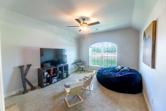 carpeted living room with a ceiling fan, baseboards, and lofted ceiling