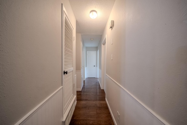 807 Eastcliff Dr, Euless, TX 76040 - corridor featuring dark wood-style floors and a textured ceiling