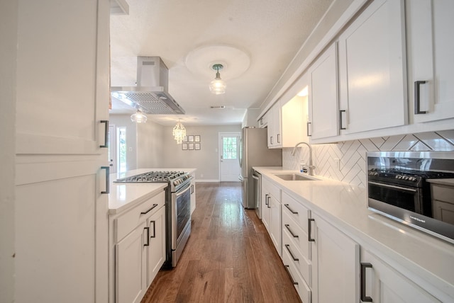 807 Eastcliff Dr, Euless, TX 76040 - kitchen with island exhaust hood, stainless steel appliances, white cabinets, and light countertops