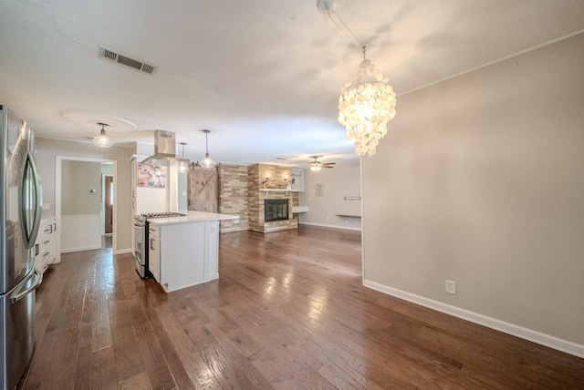 807 Eastcliff Dr, Euless, TX 76040 - kitchen featuring ceiling fan, stainless steel appliances, open floor plan, light countertops, and a chandelier