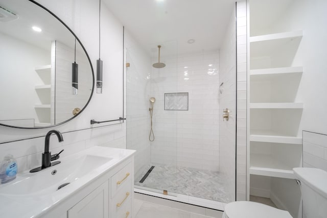 807 Eastcliff Dr, Euless, TX 76040 - full bath featuring vanity, tiled shower, tile patterned floors, and tile walls