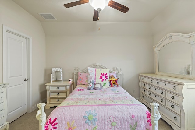 bedroom featuring light carpet, a ceiling fan, vaulted ceiling, and visible vents