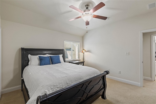 bedroom featuring visible vents, a ceiling fan, baseboards, and light colored carpet