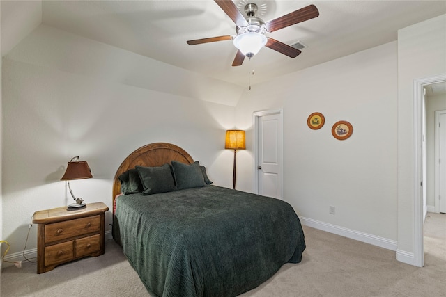 bedroom featuring a ceiling fan, light carpet, baseboards, lofted ceiling, and visible vents