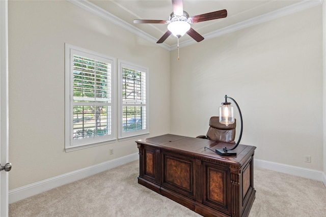 office area with a ceiling fan, light carpet, crown molding, and baseboards