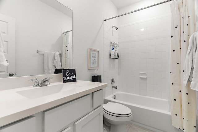 full bathroom with shower / tub combo with curtain, tile patterned flooring, vanity, and toilet