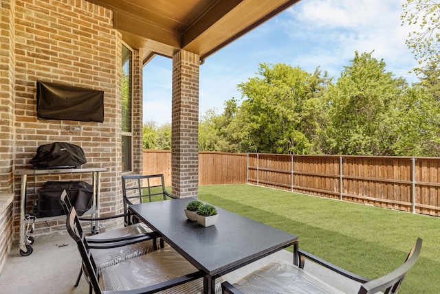 view of patio / terrace featuring a fenced backyard and outdoor dining area