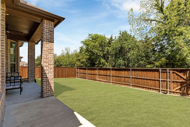 view of yard featuring a patio and a fenced backyard