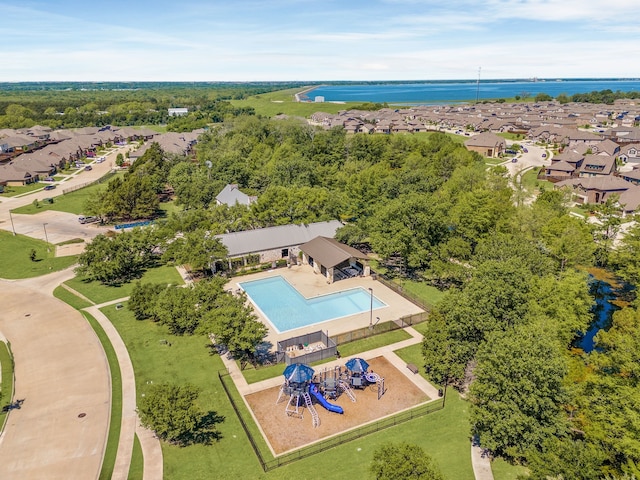 birds eye view of property with a water view