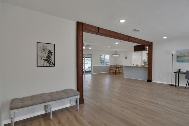 living area featuring recessed lighting, baseboards, visible vents, and light wood-style flooring