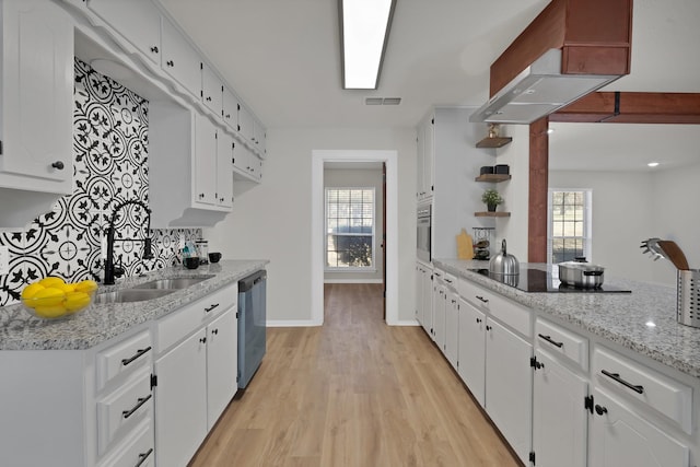 kitchen featuring white cabinets, open shelves, a sink, dishwasher, and light wood-type flooring