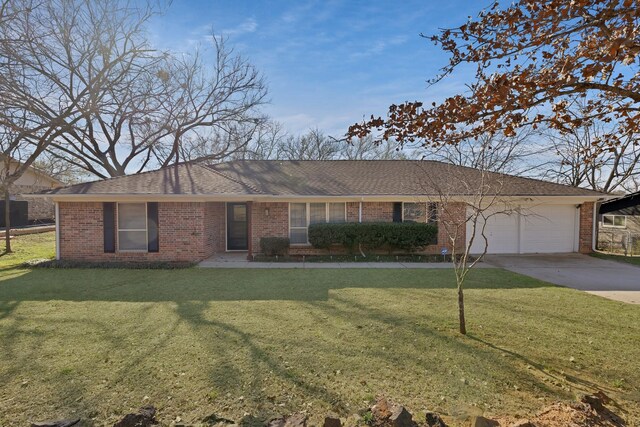 ranch-style house featuring brick siding, driveway, a front lawn, and a garage