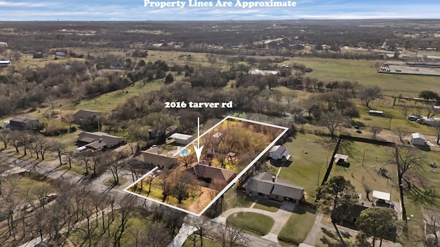 birds eye view of property with a rural view