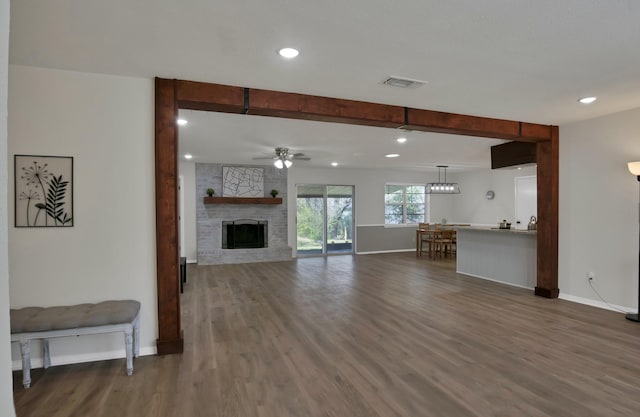 unfurnished living room with recessed lighting, baseboards, dark wood finished floors, and ceiling fan