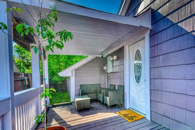 doorway to property featuring a wooden deck and fence