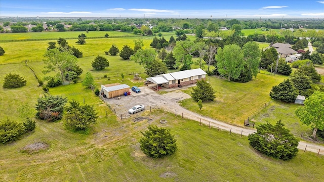 birds eye view of property with a rural view