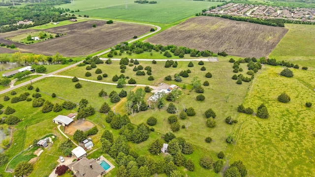 birds eye view of property with a rural view