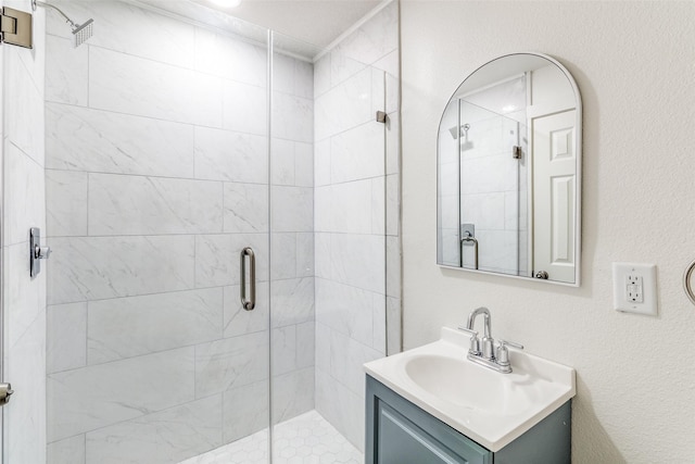bathroom with vanity and a shower stall